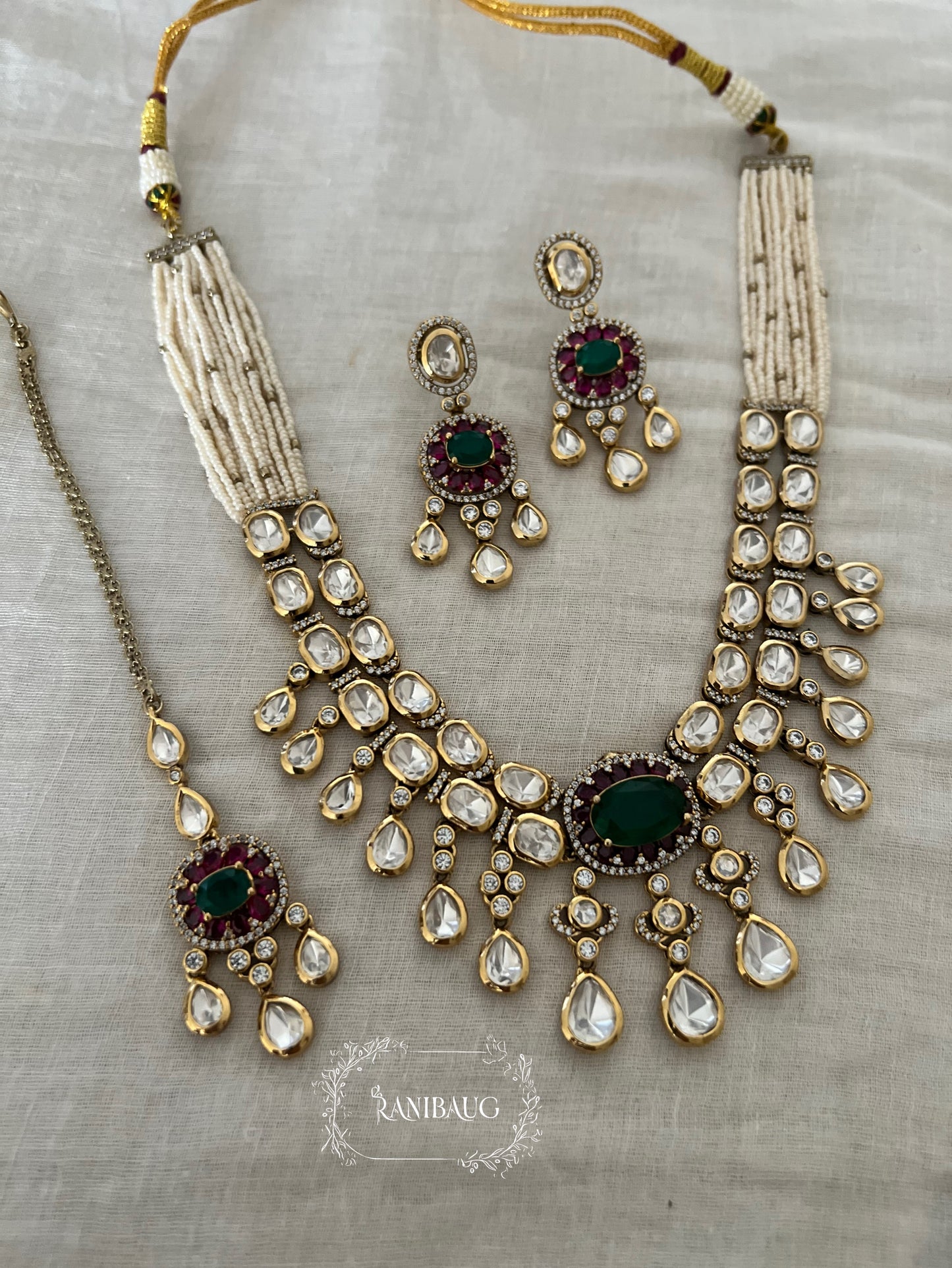 Kumud Light Green Teardrop Center Motif Two Layered Kundan Studded Gold Finish Premium Festive Necklace Set By Ranibaug