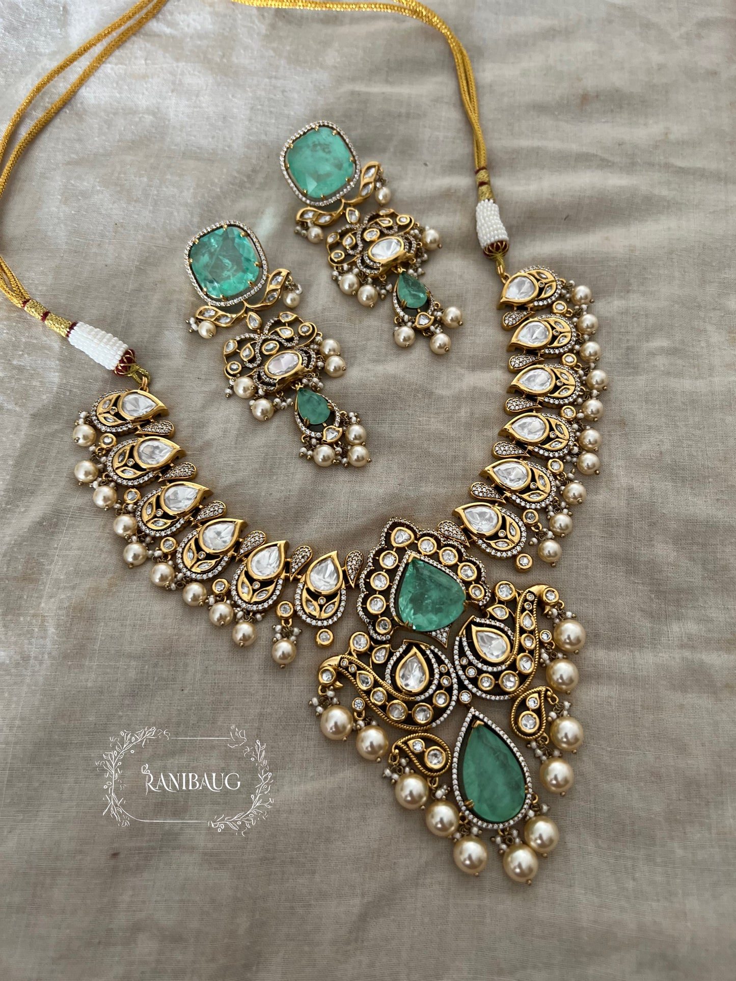 Firozi Teardrop Motif Polki Kundan And Mint Stone Studded Victorian Finish Pearl Adorned Premium Necklace Set By Ranibaug