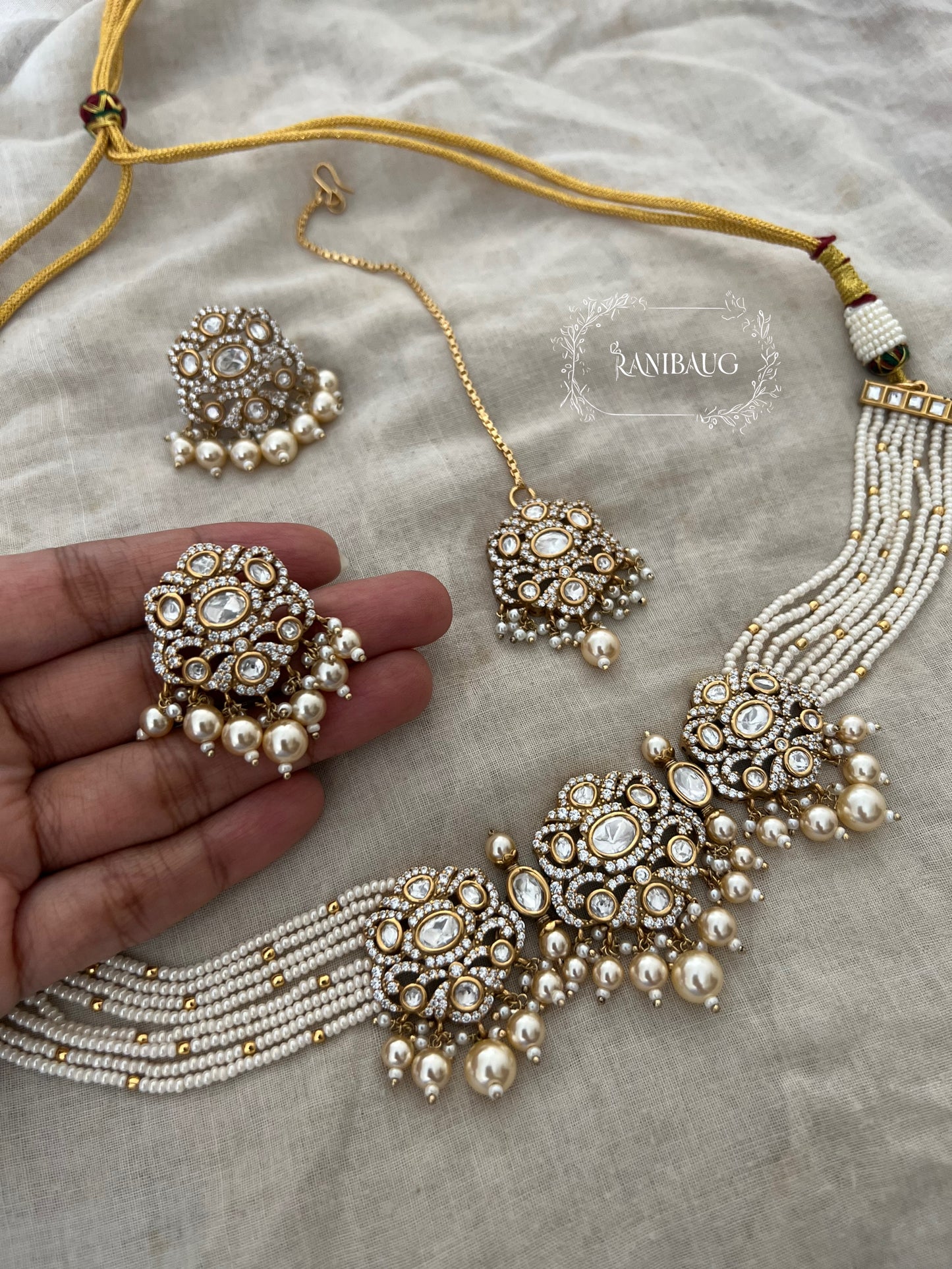 Hema Pearl Polki Zirconnia Pearl Adorned Beaded Multi Strand Royal Choker Necklace Set With Maang Tikka By Ranibaug