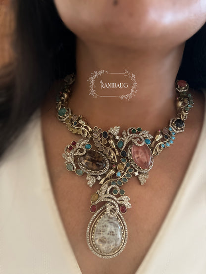 Sabya Multicolor Gemstone Kundan And Pearl Tejasvi Choker Jewellery Set In Antique Gold Finish By Ranibaug