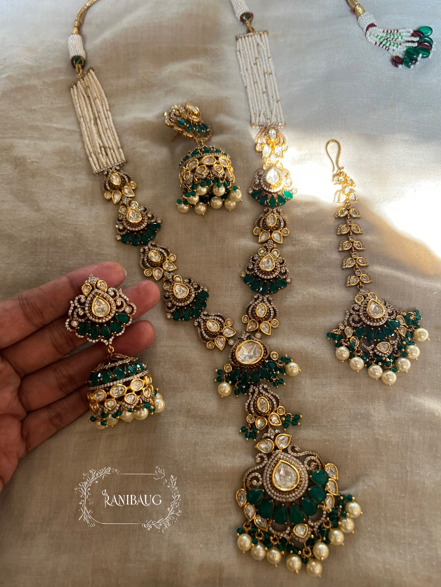 Kaikeyi Emerald Stone And Polki Studded Victorian Gold Finish Trendy Wedding Jewelry Set By Ranibaug