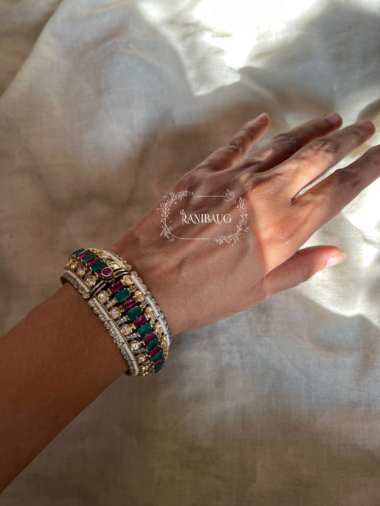 Kairavi Emerald Ruby Stones Polki Studded Gold Finish Pearl Adorned Broad Statement Kada Bangles By Ranibaug
