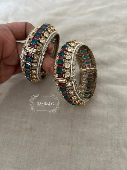 Kairavi Emerald Ruby Stones Polki Studded Gold Finish Pearl Adorned Broad Statement Kada Bangles By Ranibaug