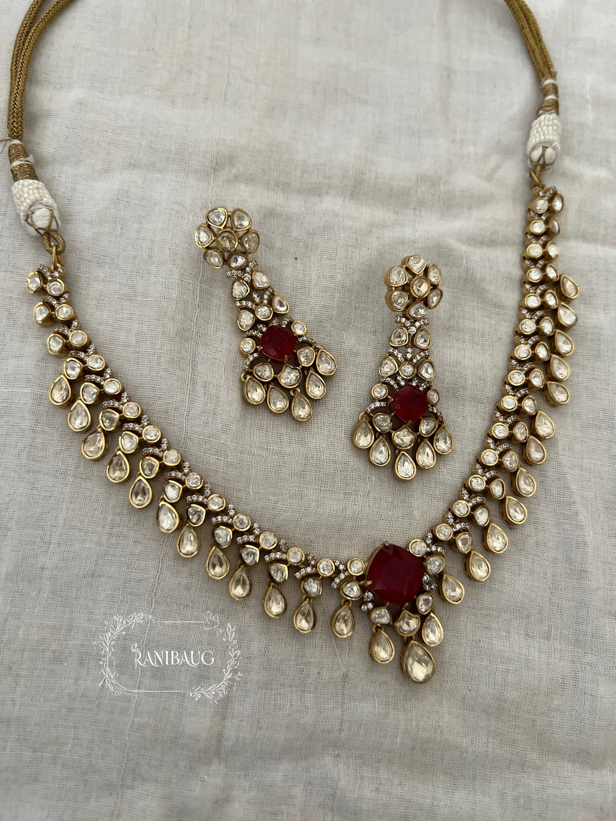 Kairavi Gemstone Motif Polki Adorned Gold Finish Designer Festive Jewellery Set By Ranibaug