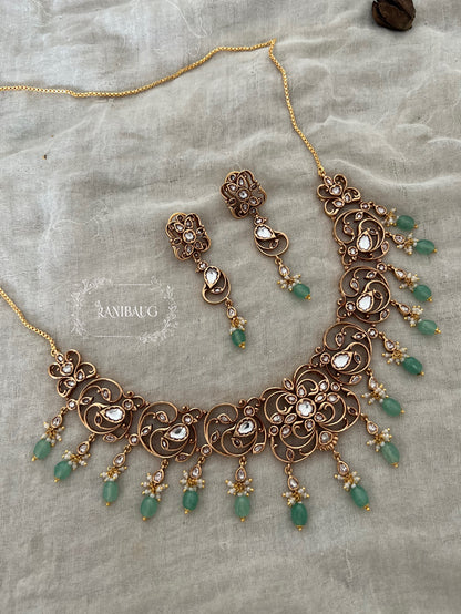 Keerthi Gold Intricate Design Work Polki Studded Beaded Tassel Heritage Necklace Set By Ranibaug
