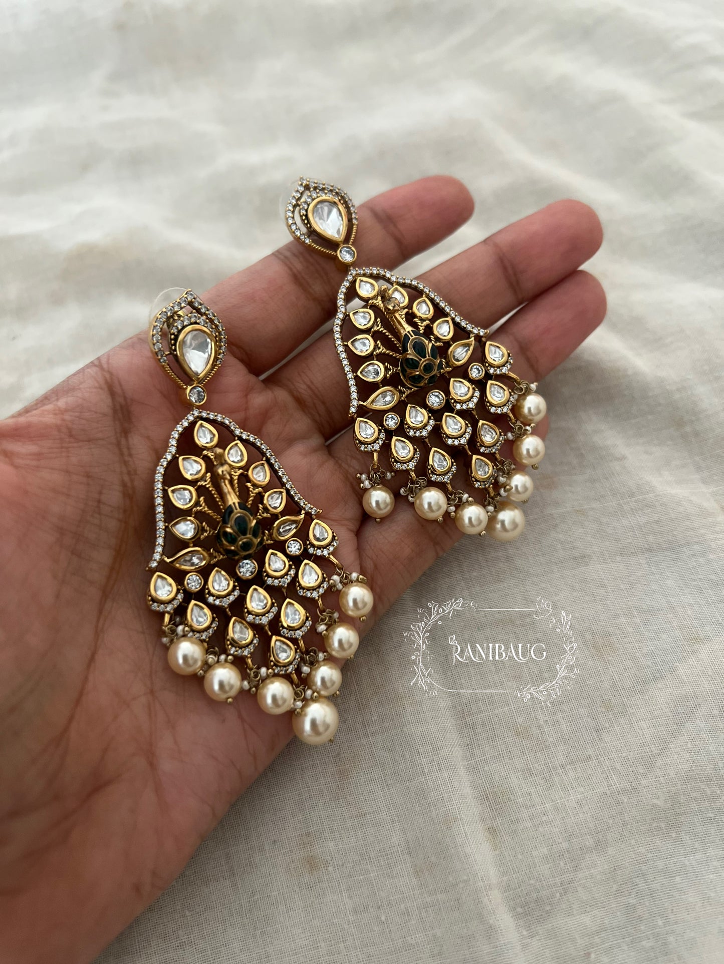 Kripa Kundan Studded Peacock Chandbali Pearl Drop Earrings By Ranibaug