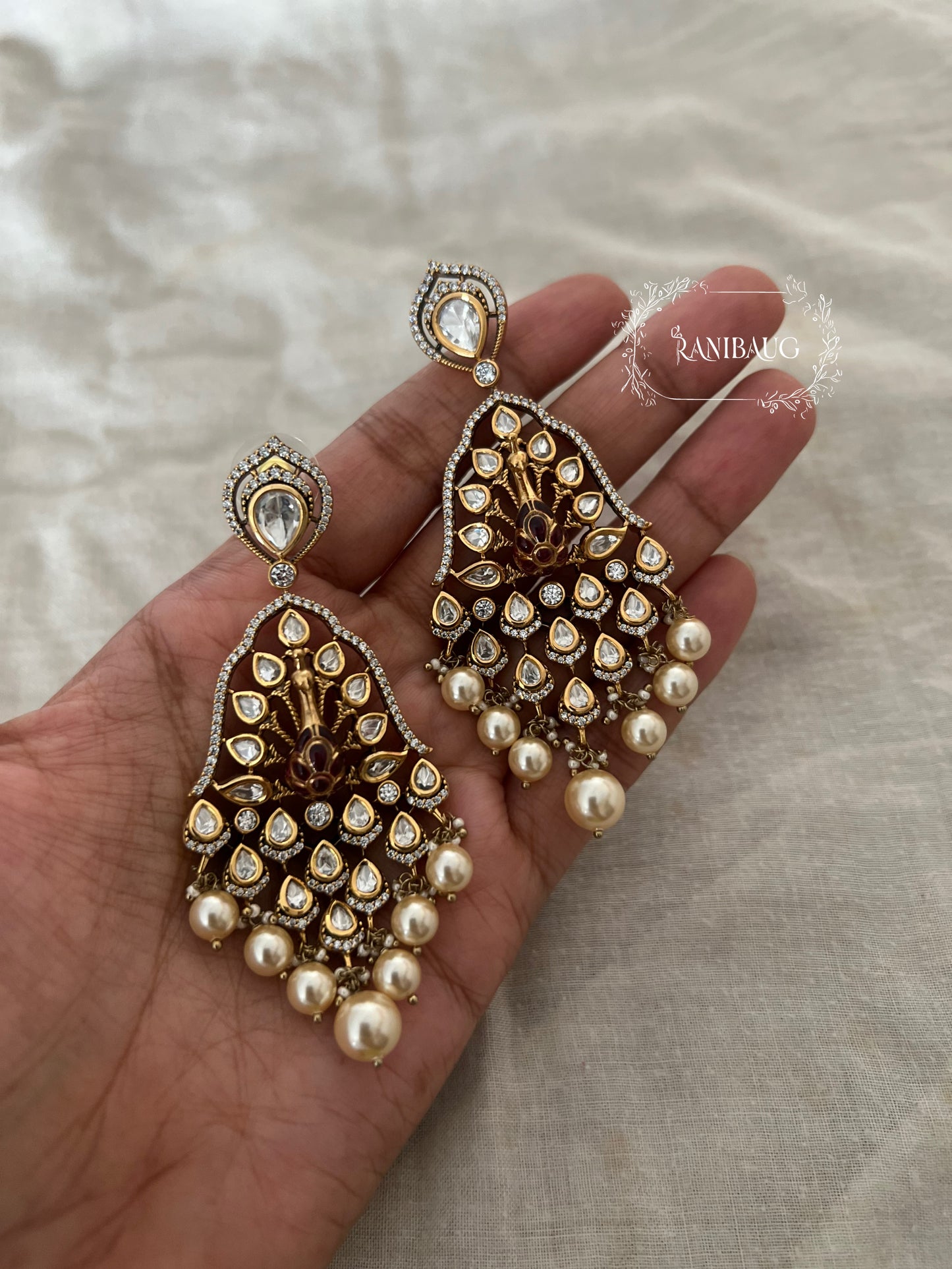 Kripa Kundan Studded Peacock Chandbali Pearl Drop Earrings By Ranibaug