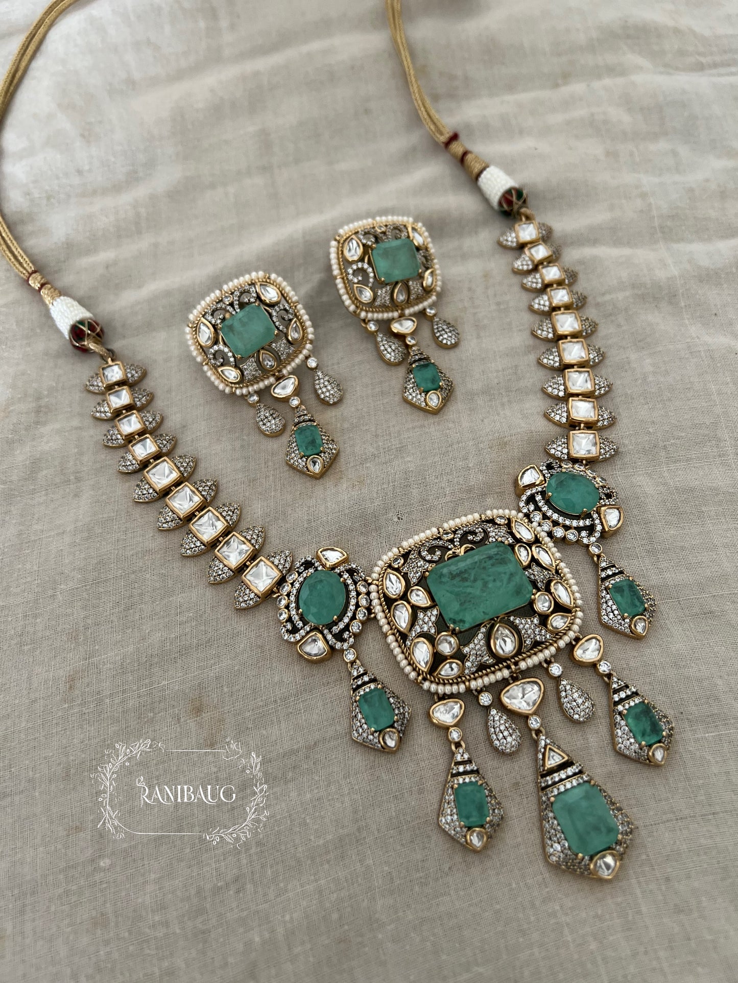 Krishika Vintage Statement Jewellery Set Adorned With Mint And Pink Gemstones Polki Studded In Premium Gold Finish By Ranibaug