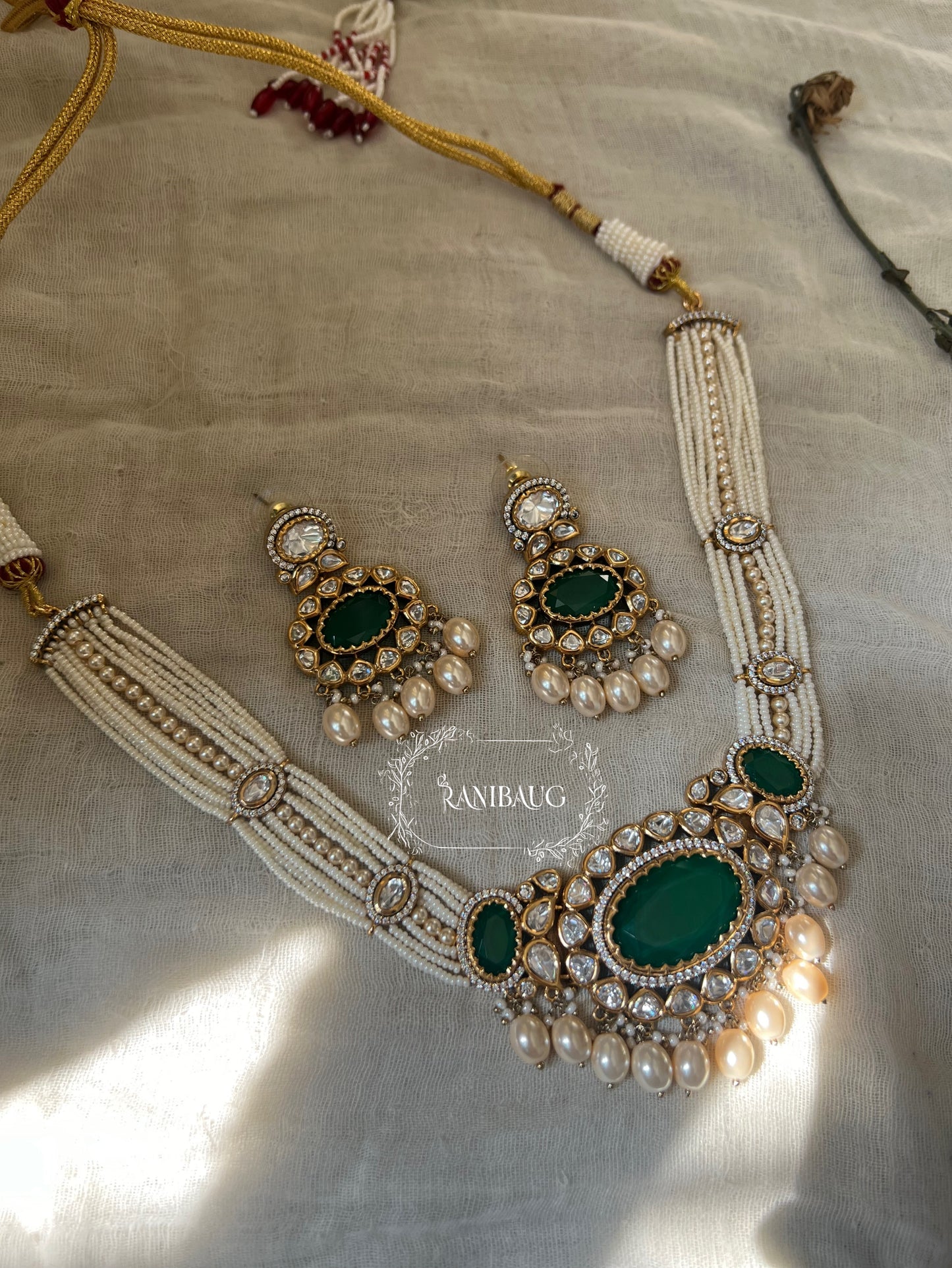 Labhi Gold Finish Polki Kundan And Pearl Necklace With Emerald Center Stone By Ranibaug