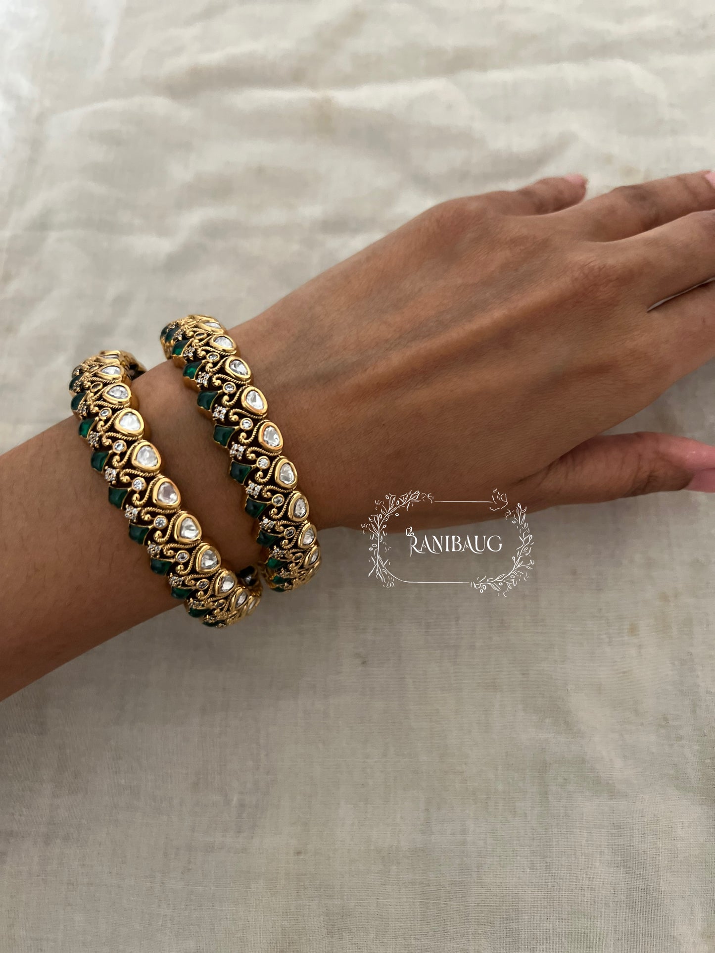 Manali Polki Kundan Studded Gold Plated Festive Bangles In Emerald Green And Ruby Stones By Ranibaug