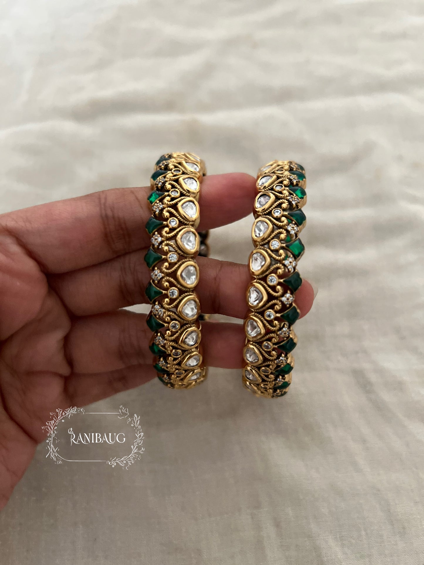 Manali Polki Kundan Studded Gold Plated Festive Bangles In Emerald Green And Ruby Stones By Ranibaug