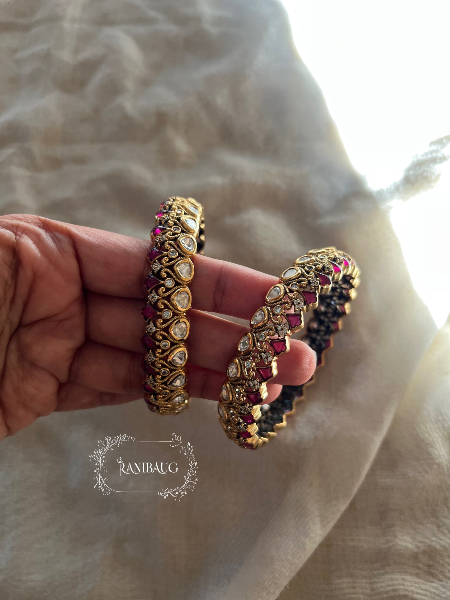 Manali Polki Kundan Studded Gold Plated Festive Bangles In Emerald Green And Ruby Stones By Ranibaug