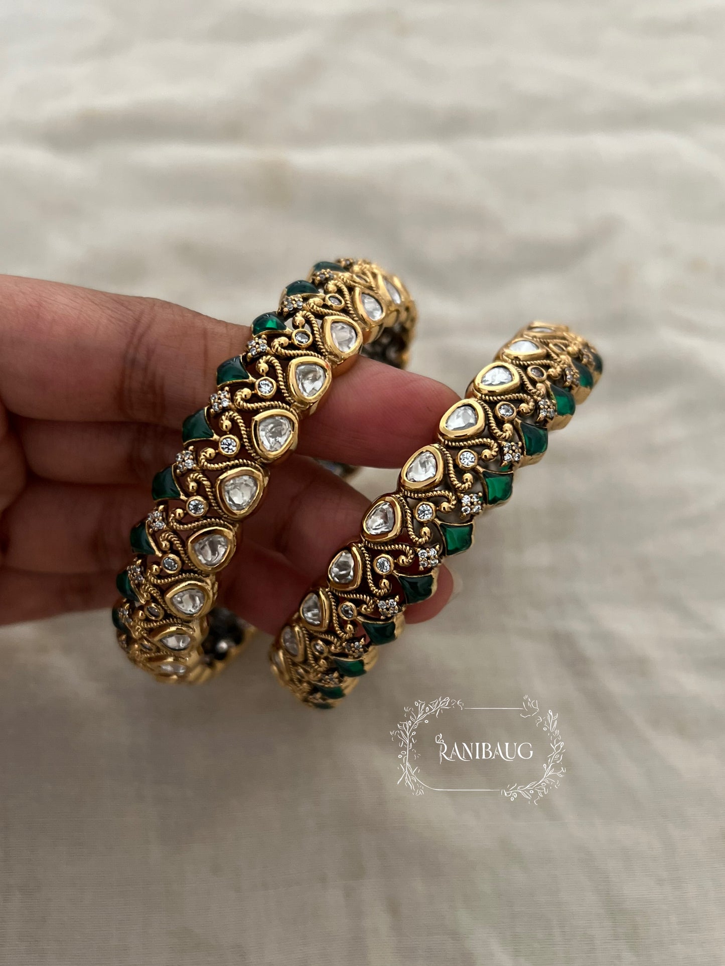 Manali Polki Kundan Studded Gold Plated Festive Bangles In Emerald Green And Ruby Stones By Ranibaug