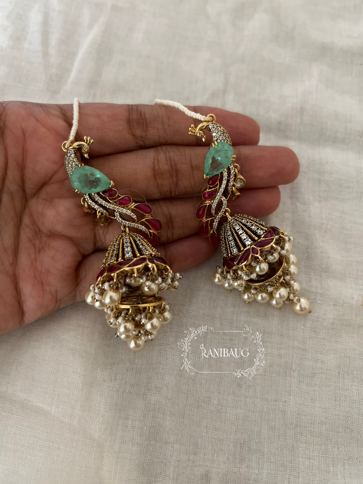 Manasvi Kundan Polki Peacock Motif Designer Royal Statement Earrings With Seed Pearl Hair Chain By Ranibaug