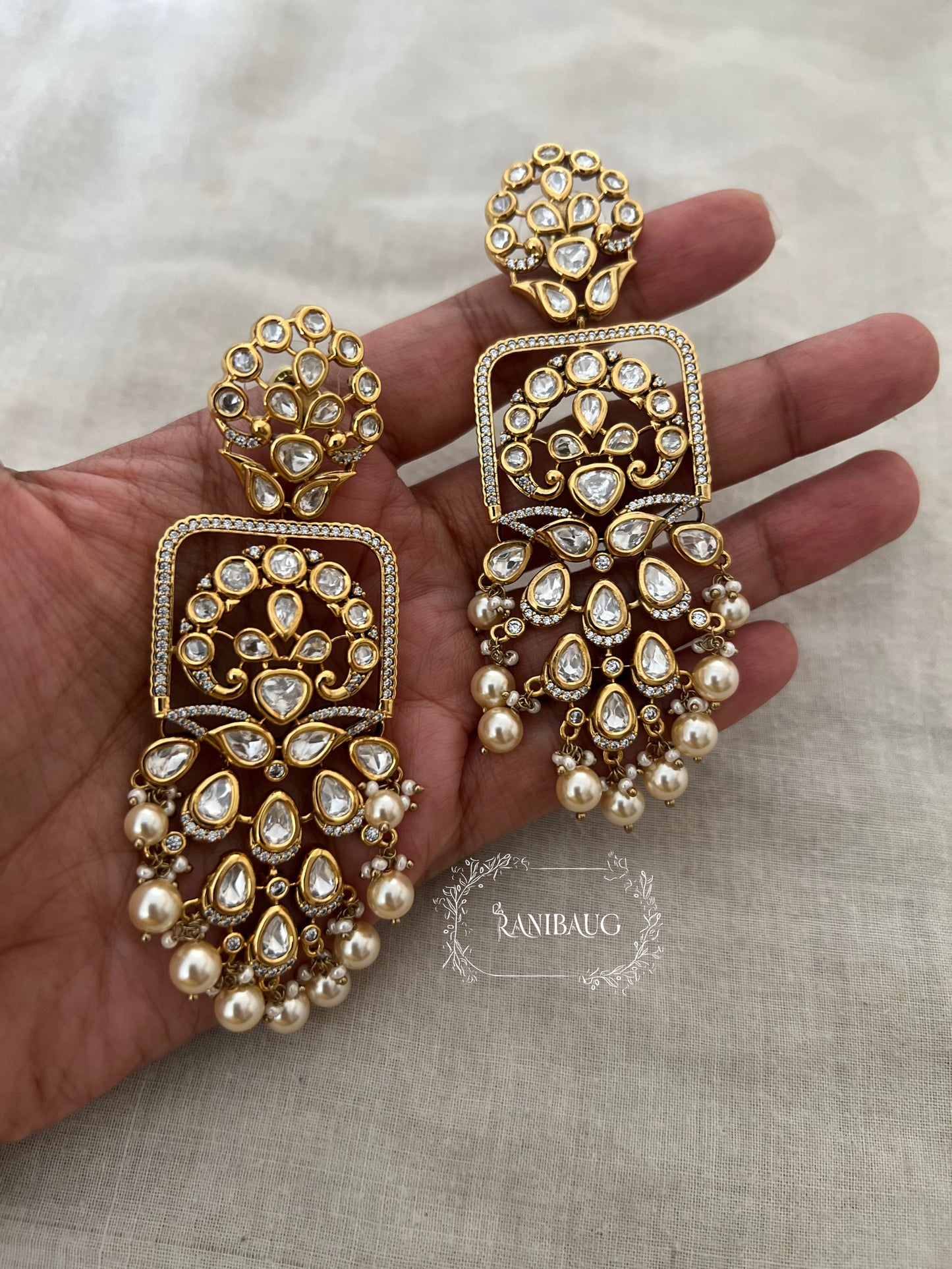 Maya Royal Statement Bridal Premium Gold Finish Mossainite And Pearl Earrings By Ranibaug