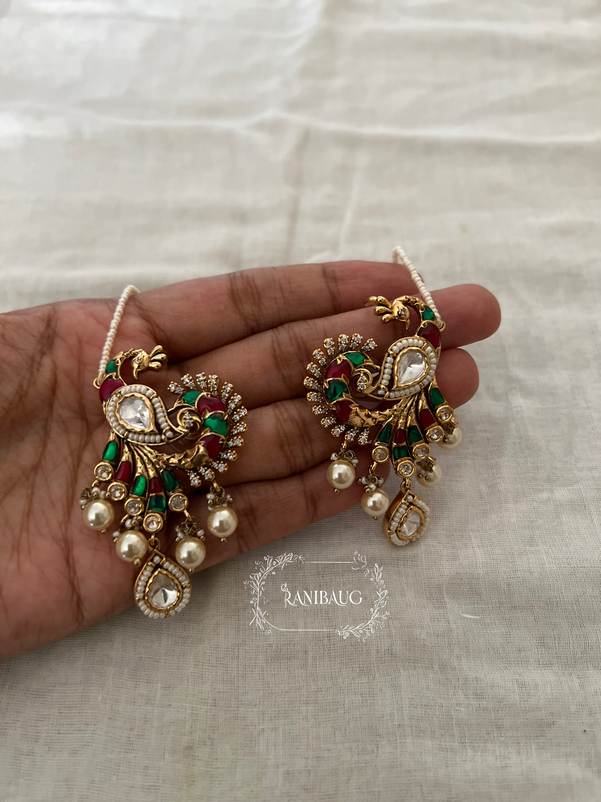 Mayavi Peacock Polki Pearl Adorned Gold Finish Designer Hair Chain Earrings By Ranibaug