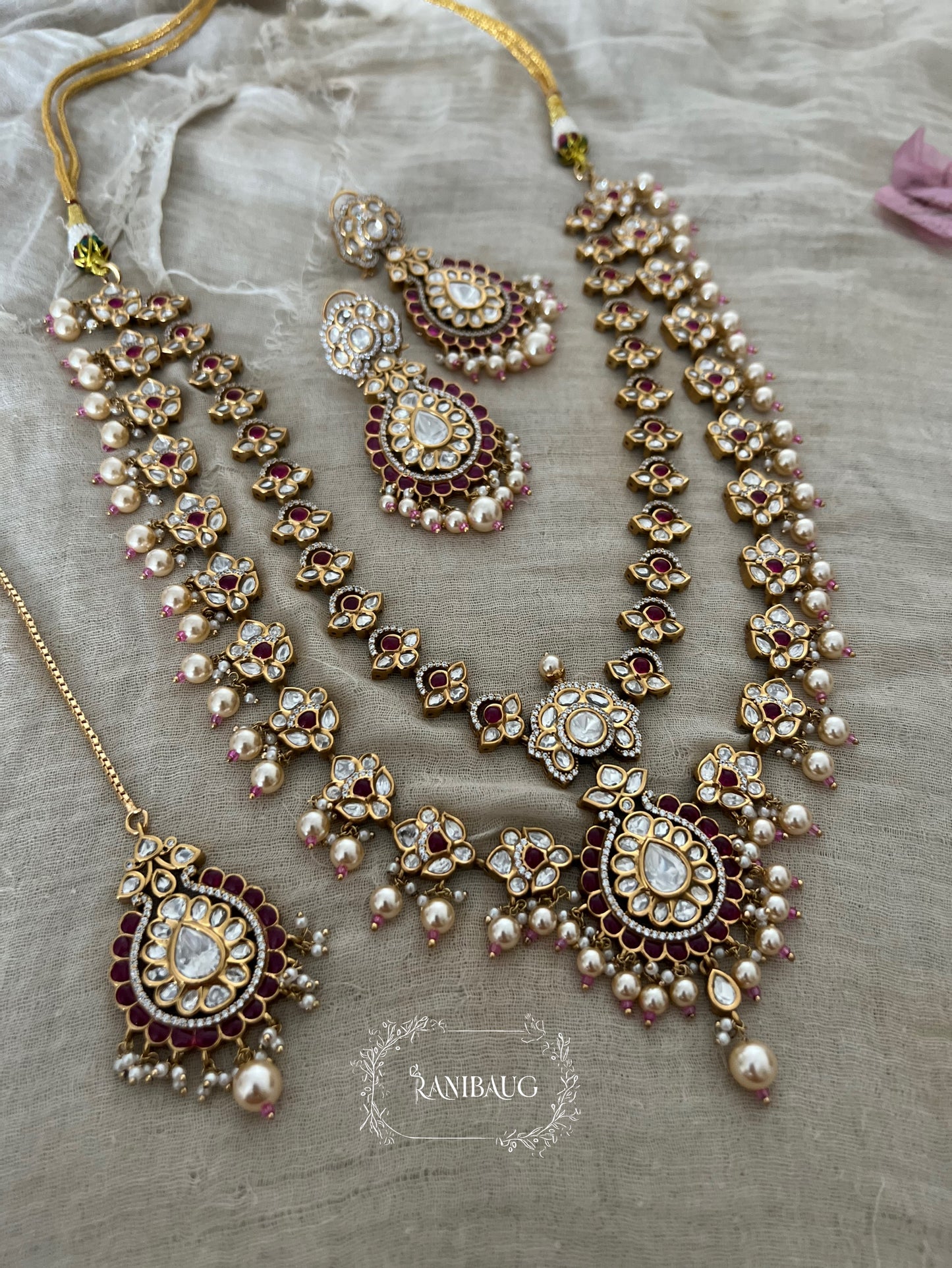 Mayera Layered Gold Plated Traditional Style Wedding Necklace Jewellery Set With Earrings And Maang Tikka By Ranibaug