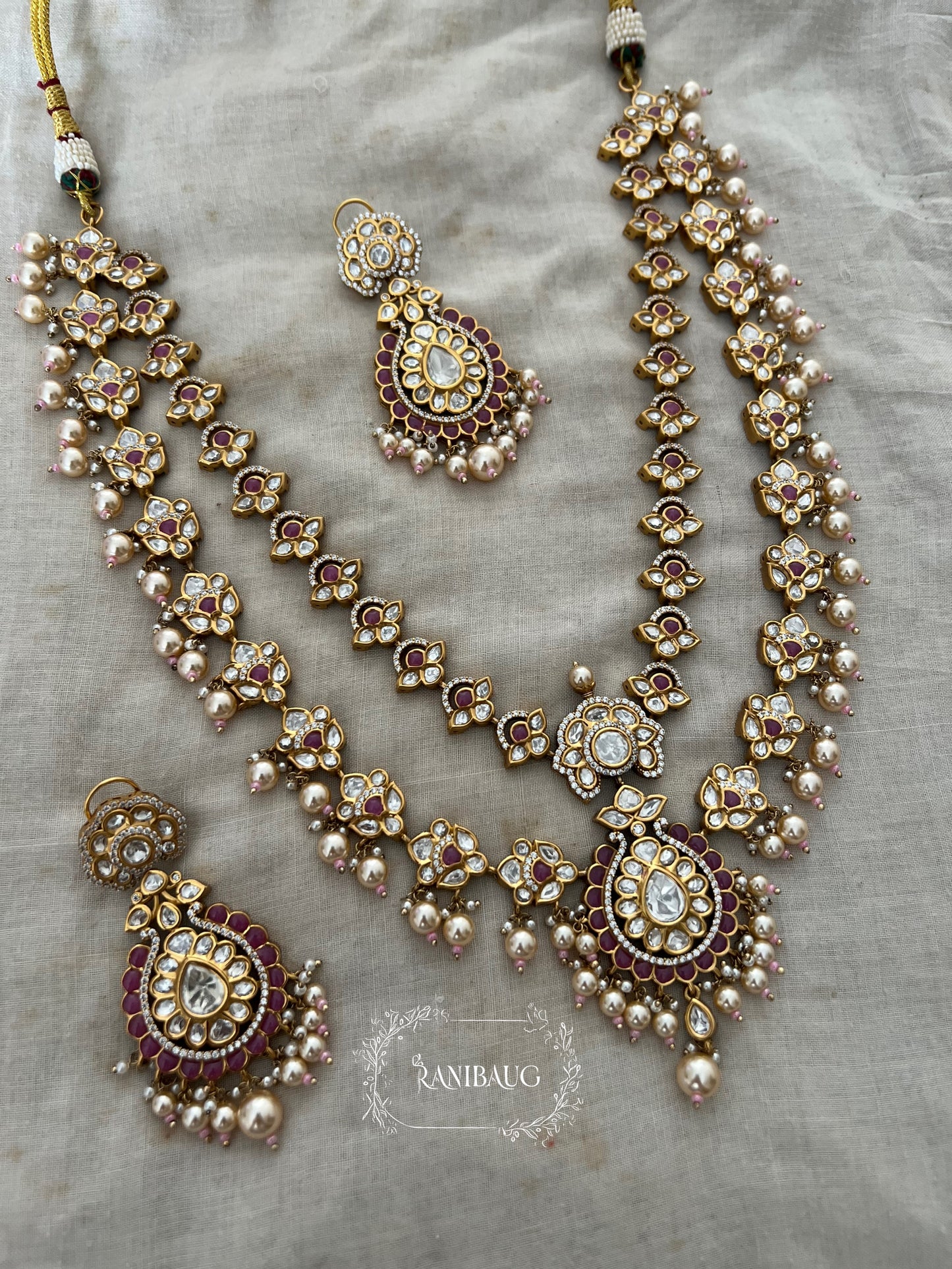 Mayera Layered Gold Plated Traditional Style Wedding Necklace Jewellery Set With Earrings And Maang Tikka By Ranibaug