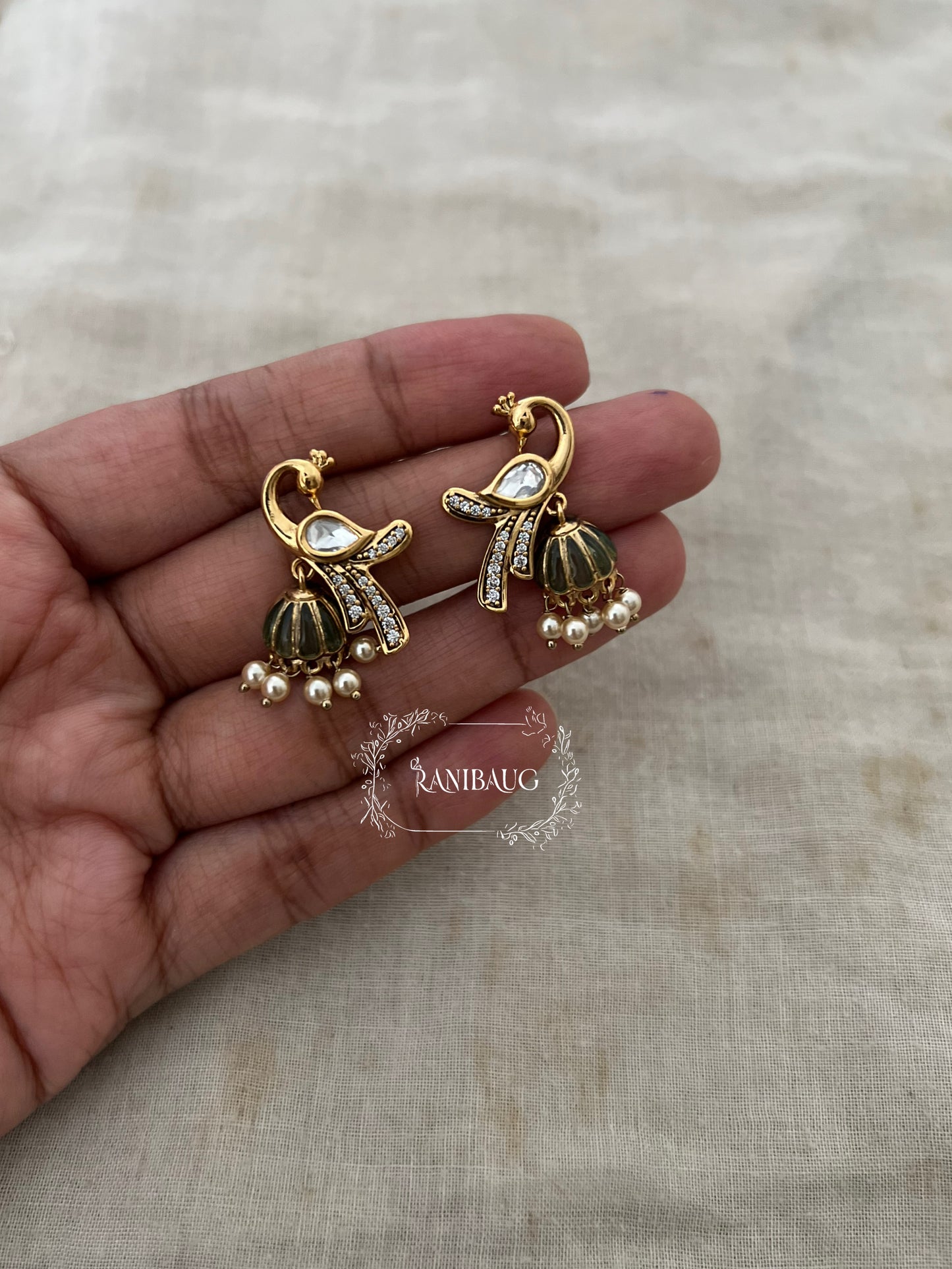 Mayra Peacock Motif Polki Pearl Studded Enamel Zirconia Adorned Premium Gold Plated Ear Studs Jewelry By Ranibaug