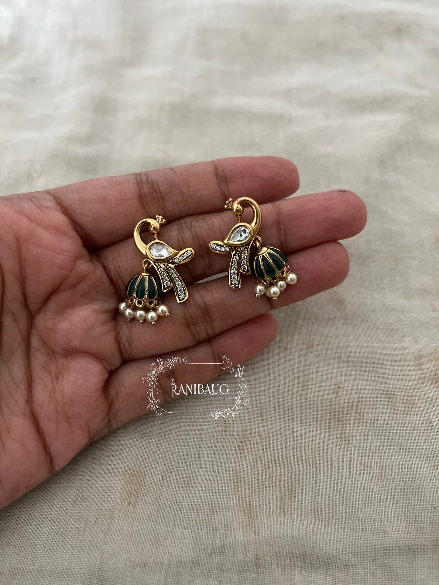 Mayra Peacock Motif Polki Pearl Studded Enamel Zirconia Adorned Premium Gold Plated Ear Studs Jewelry By Ranibaug