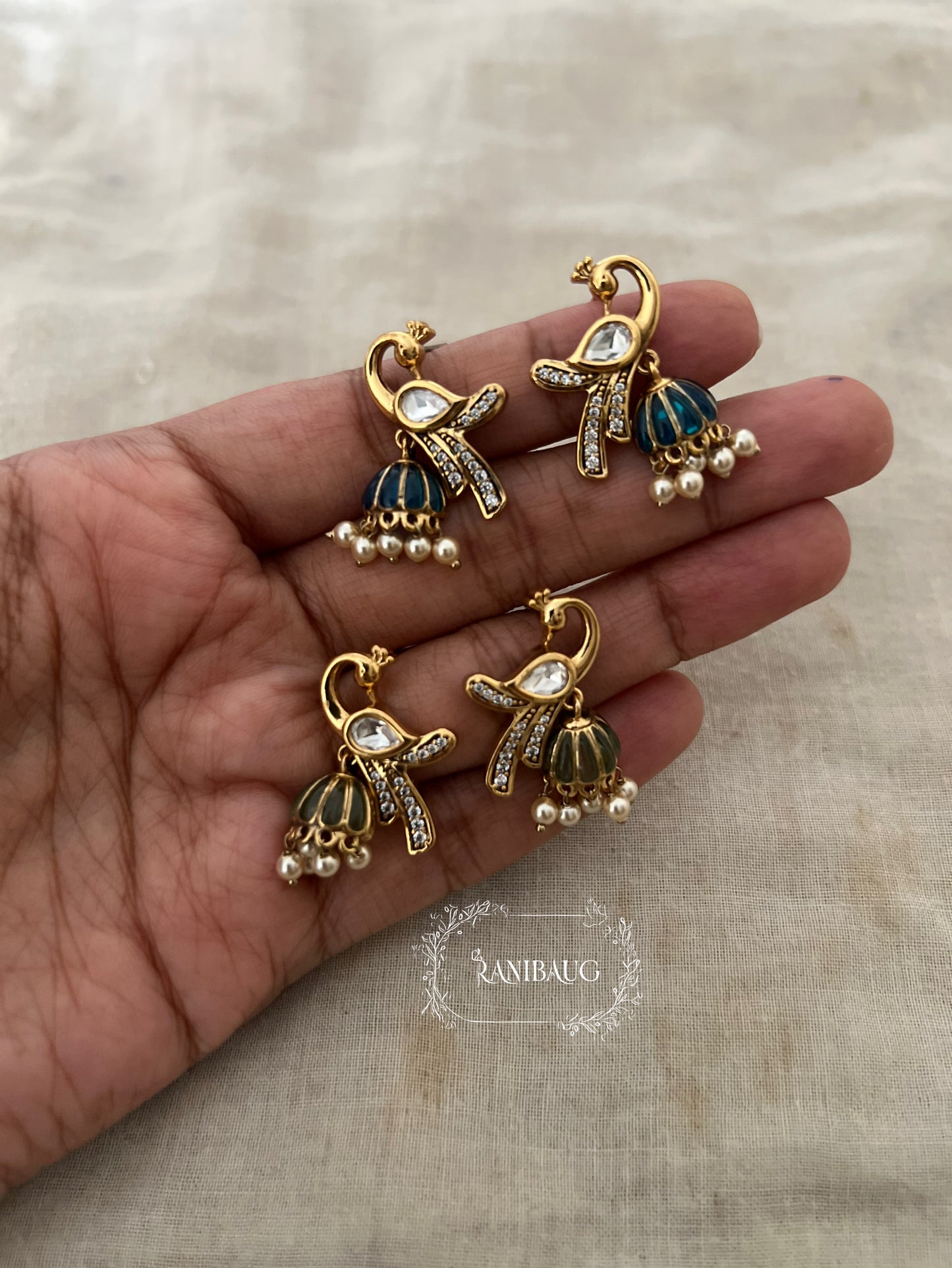 Mayra Peacock Motif Polki Pearl Studded Enamel Zirconia Adorned Premium Gold Plated Ear Studs Jewelry By Ranibaug