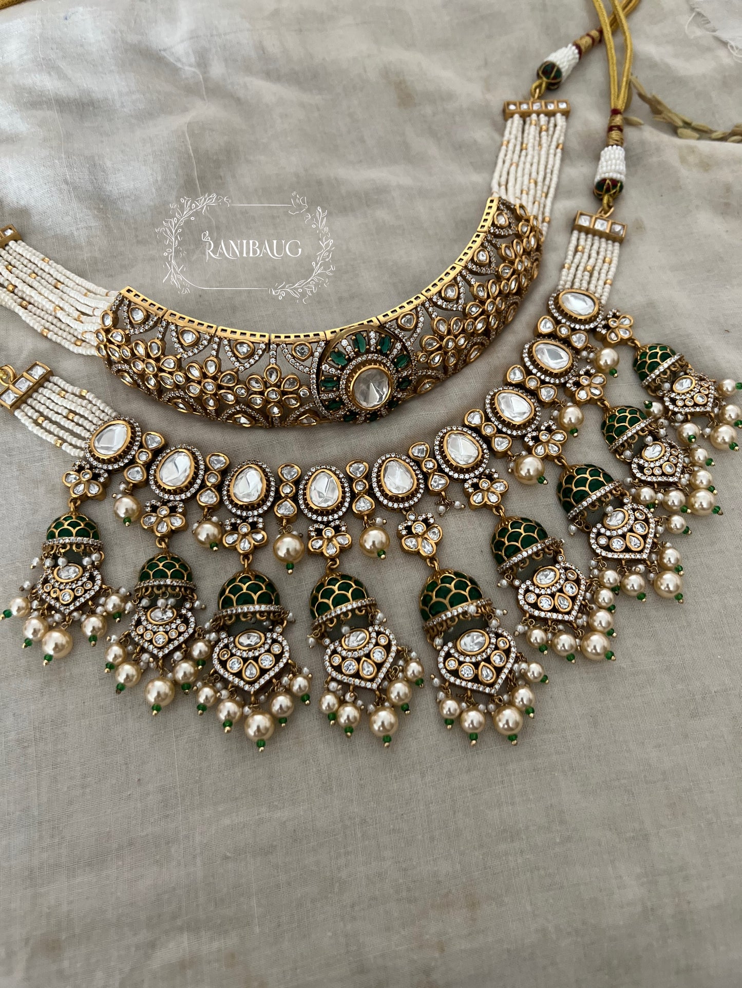Meena Kumari Maharani Emerald & Polki Jhumka-Drop Heavy Bridal Set | Antique Gold Double-Layered Choker Combo Statement Bridal Necklace Collection By Ranibaug
