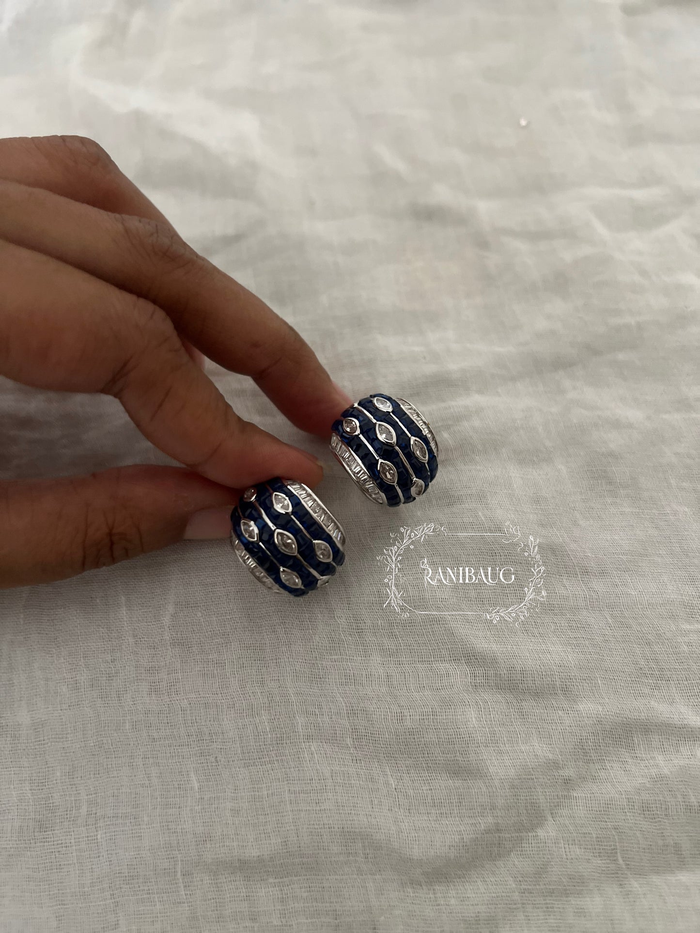 Mehera Arc Huggie Diamond Ear Studs In Different Colors By Ranibaug