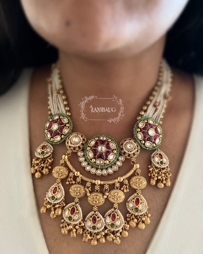 Mehrang Royal Designer Kundan Studded Pearl Beaded Gold Finish Emerald Ruby Adorned Necklace Set By Ranibaug
