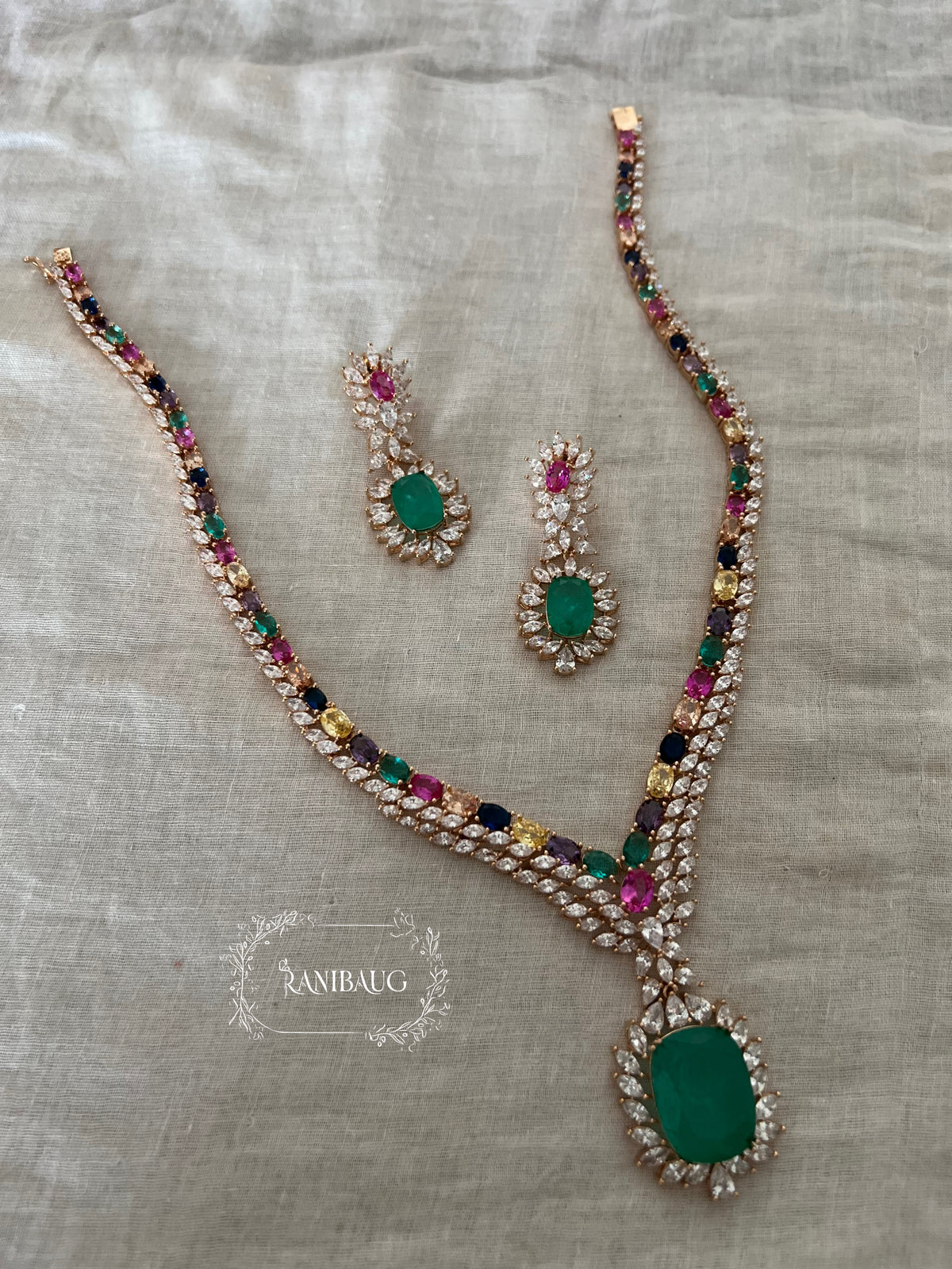 Misha Multicolor Emerald Stone Gold Finish Diamond Jewellery Set By Ranibaug