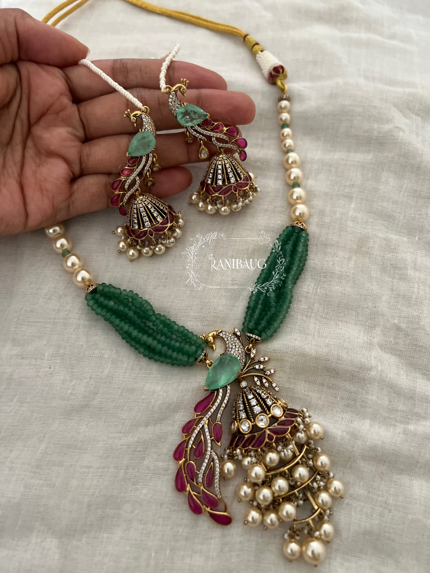 Mishka Royal Peacock Polki Pearl Adorned Necklace Jewellery Set with Ear Chain By Ranibaug