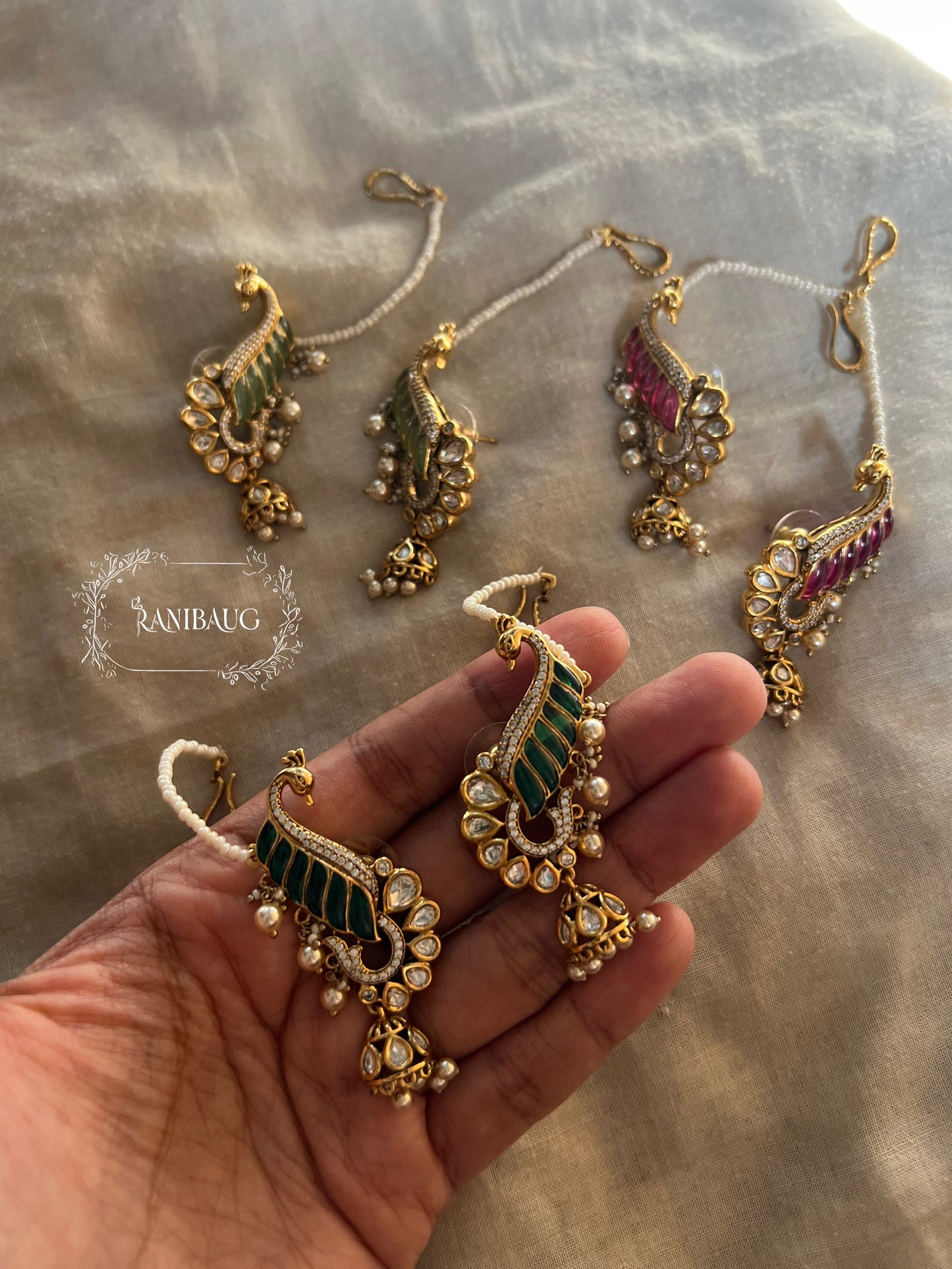 Natasha Statement Peacock Motif Gold Plated Polki Studded Earcuff Jhumki With Mini Pearl Hair Chain By Ranibaug | Designer Latest Festive Earrings Collection 2026