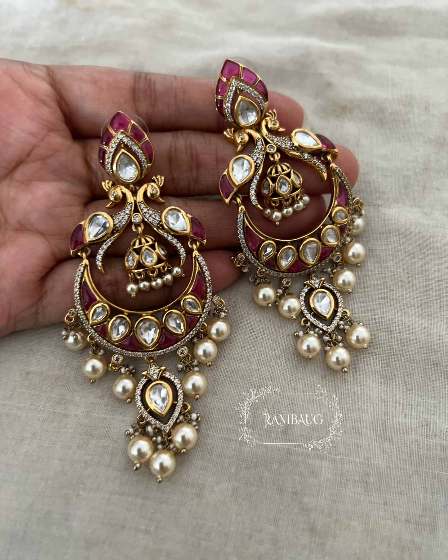 Nayani Victorian Finish Polki And Peral Adorned Peacock Chandbali With Jhumki Dangler Motif By Ranibaug