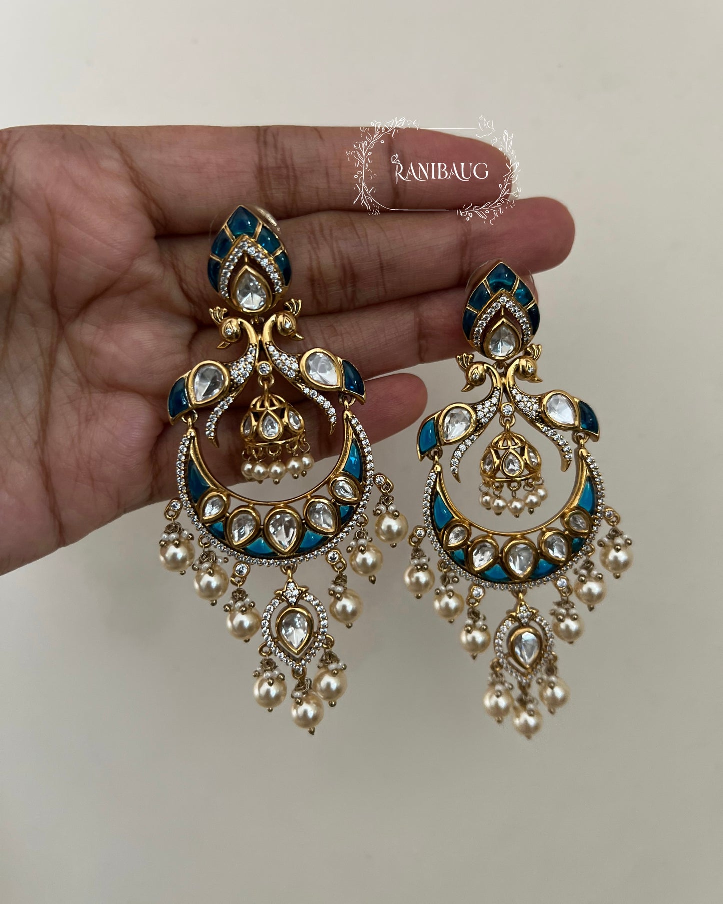 Nayani Victorian Finish Polki And Peral Adorned Peacock Chandbali With Jhumki Dangler Motif By Ranibaug
