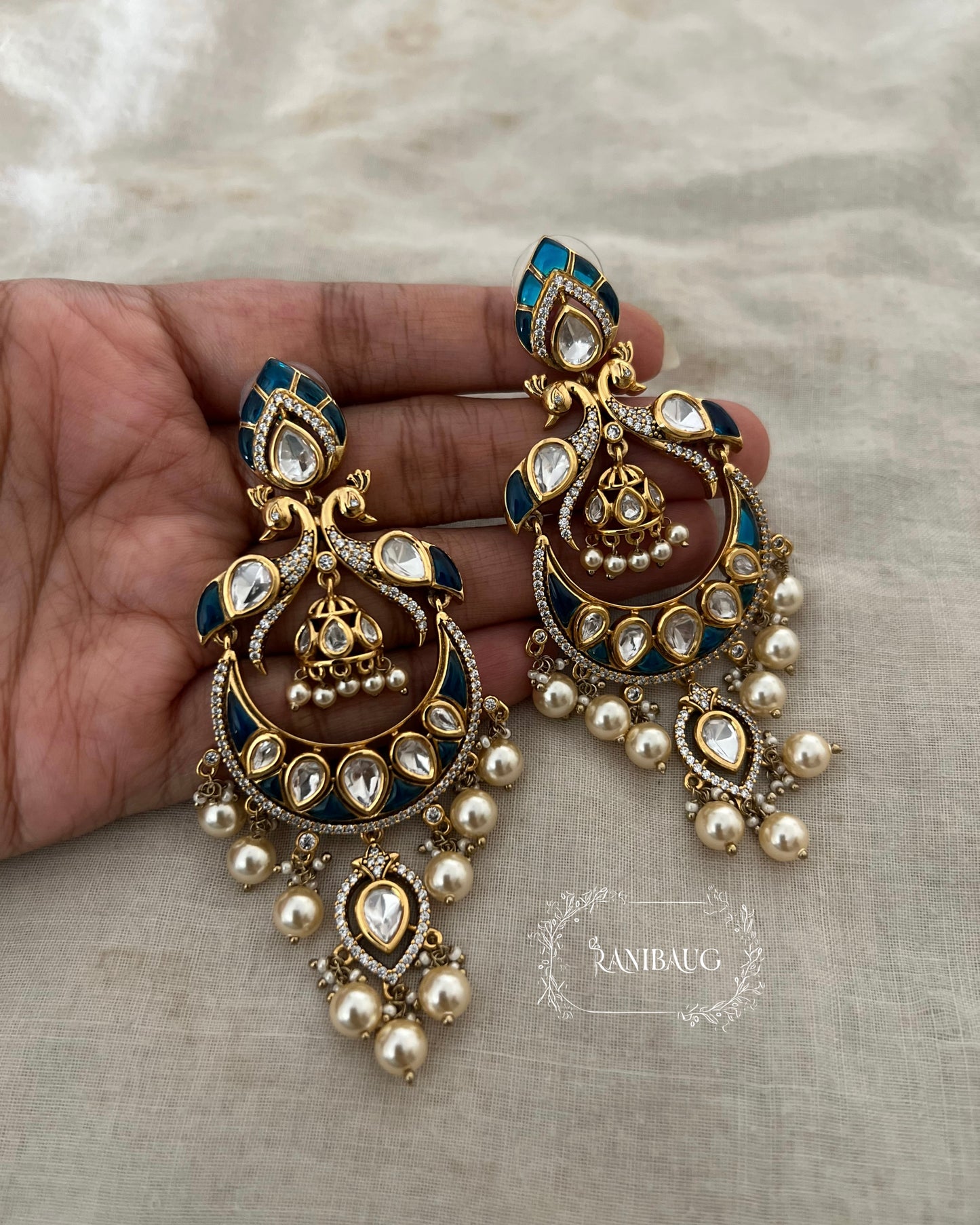 Nayani Victorian Finish Polki And Peral Adorned Peacock Chandbali With Jhumki Dangler Motif By Ranibaug