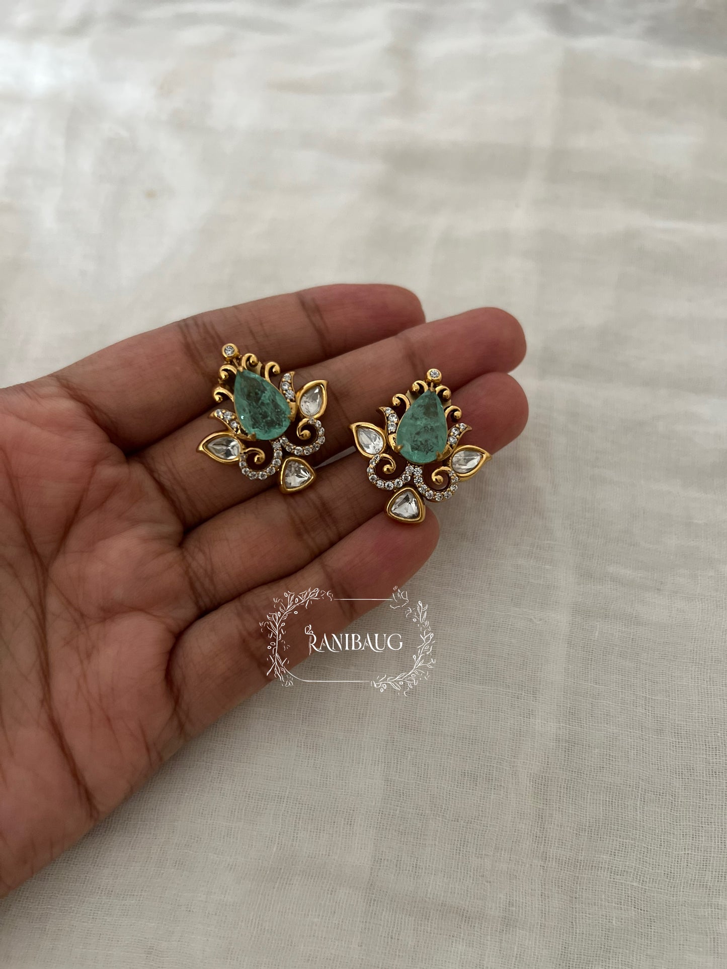 Nayera Teardrop Gemstone Motif Gold Finish Intricate Designer Polki Ear Studs By Ranibaug