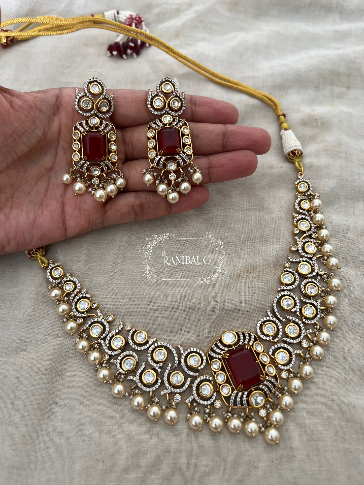 Nilakshi Gold Finish Rich Pearl Adorned Polki Studded Royal Statement Necklace Set By Ranibaug
