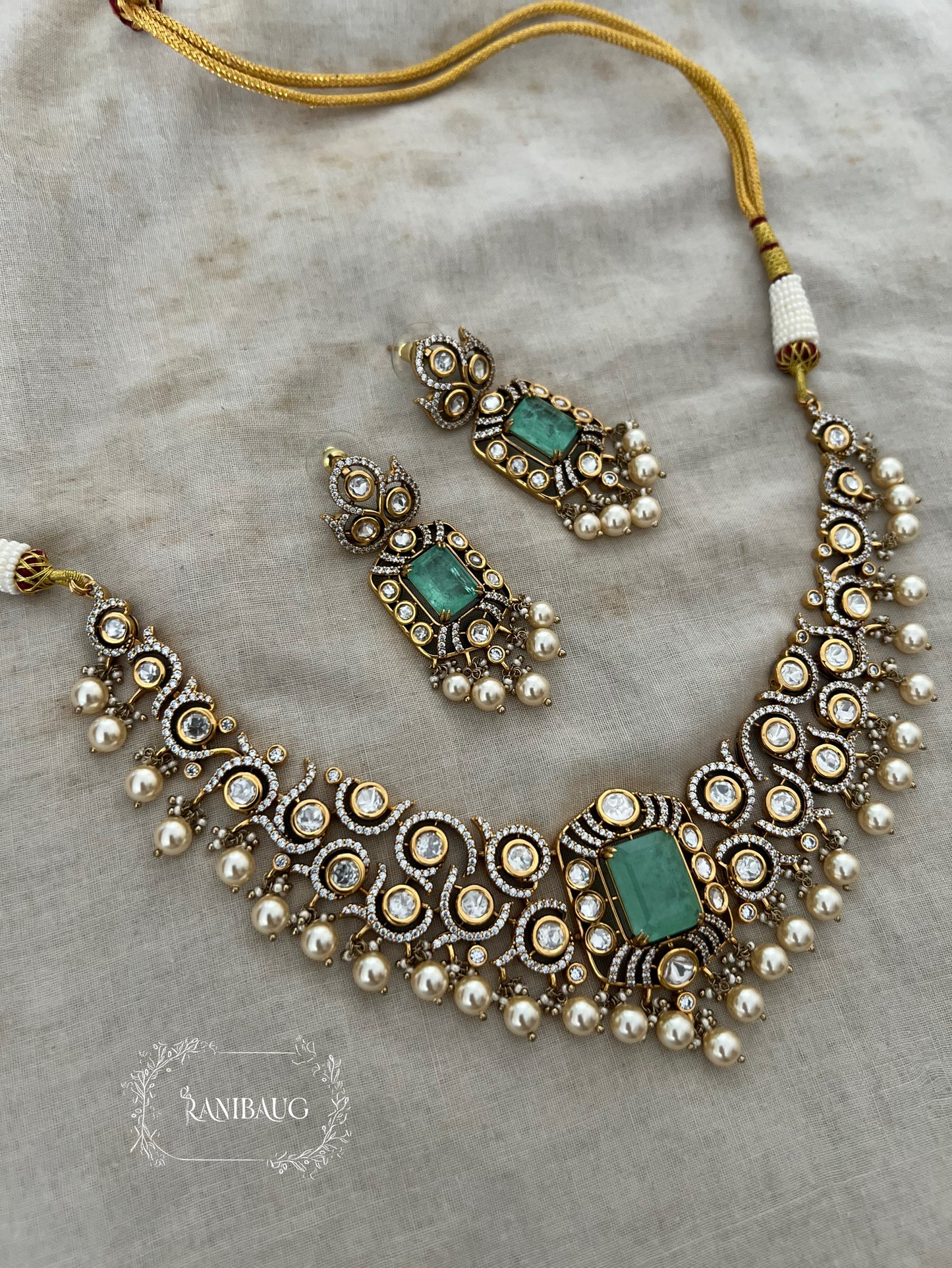 Nilakshi Gold Finish Rich Pearl Adorned Polki Studded Royal Statement Necklace Set By Ranibaug