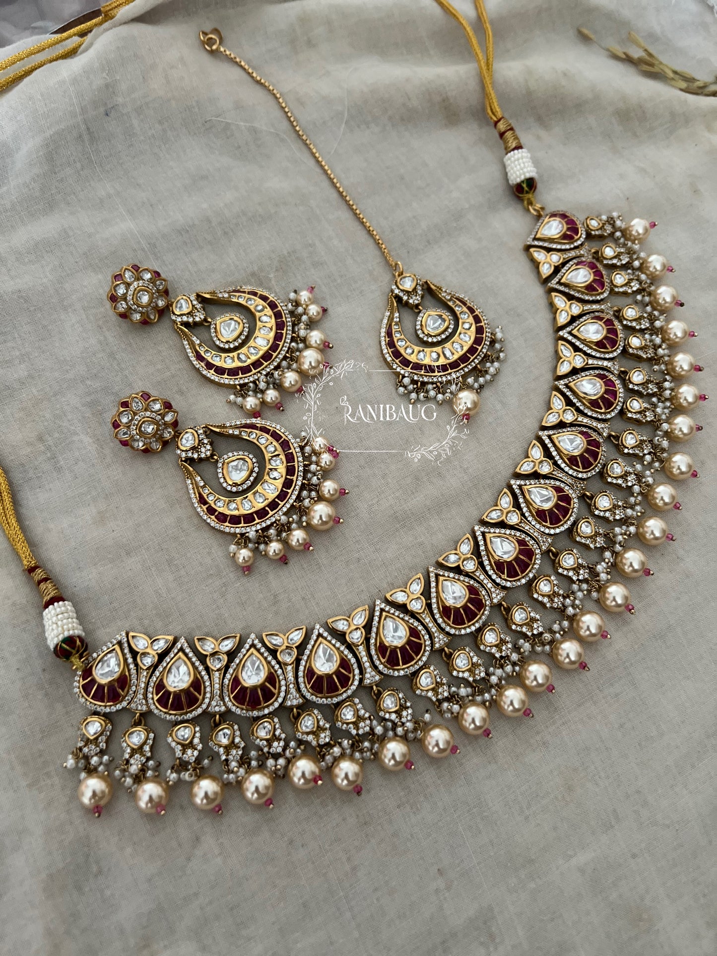 Nita Polki Kundan Necklace Set In Teardrop Enamel Motifs And Shiny Pearl Fringes In Premium Gold Finish With Contrasting Maangtikka By Ranibaug