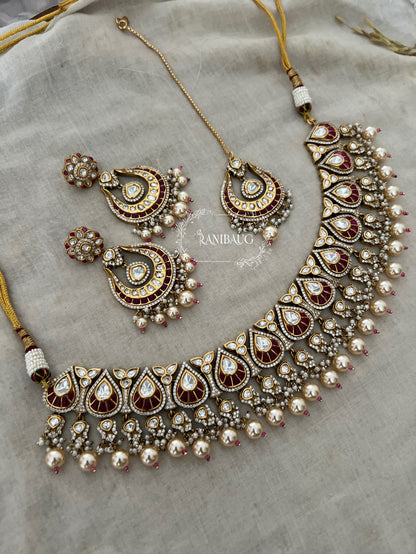 Nita Polki Kundan Necklace Set In Teardrop Enamel Motifs And Shiny Pearl Fringes In Premium Gold Finish With Contrasting Maangtikka By Ranibaug