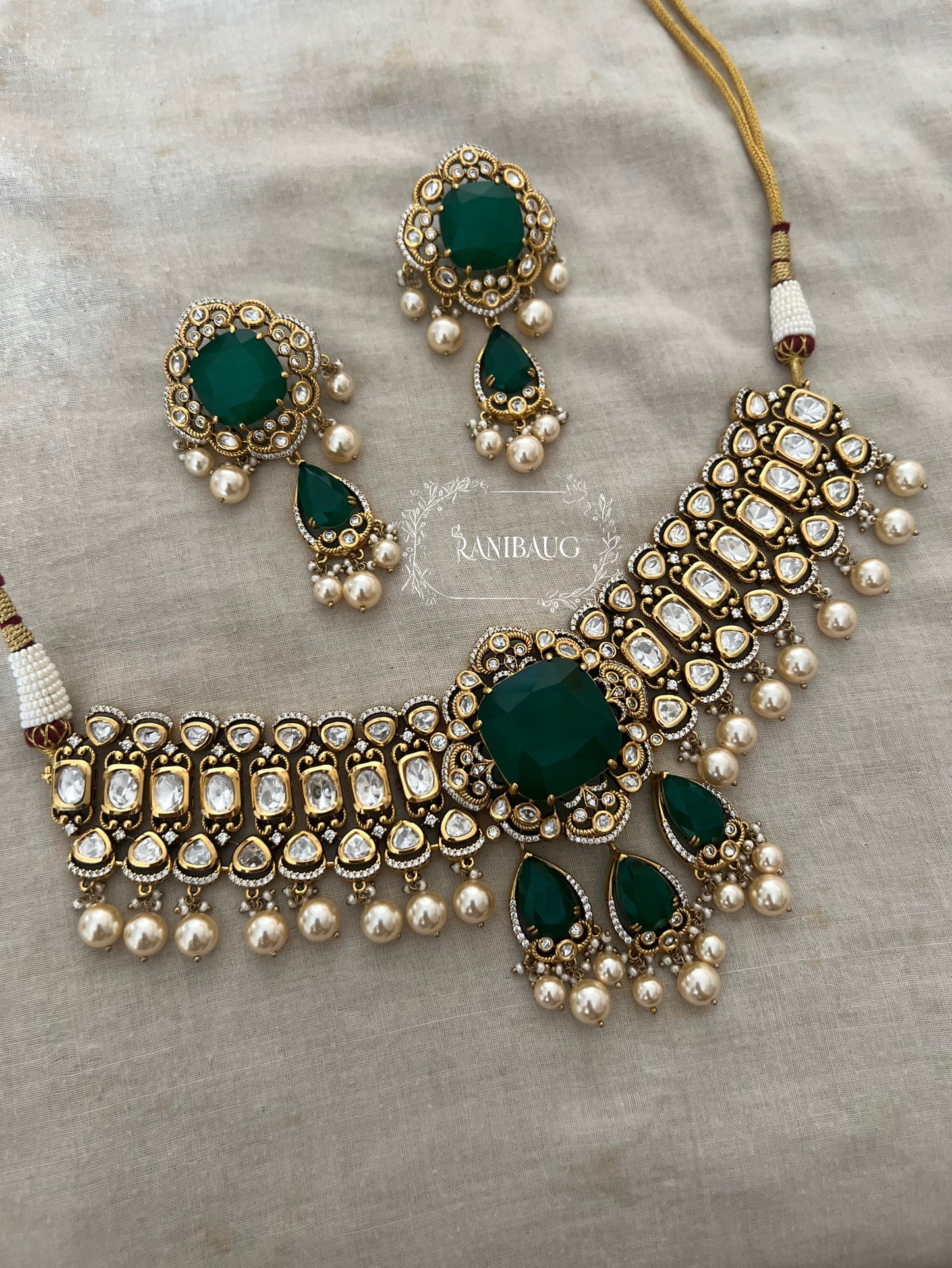 Nitya Emerald Green Motif Polki Studded Antique Golden Necklace Jewellery Set With Pearl Fringes By Ranibaug
