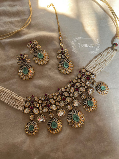 Nysa Vintage Floral Motif Mint And Ruby Accent Polki Studded Necklace Set In Matt Gold Finish By Ranibaug