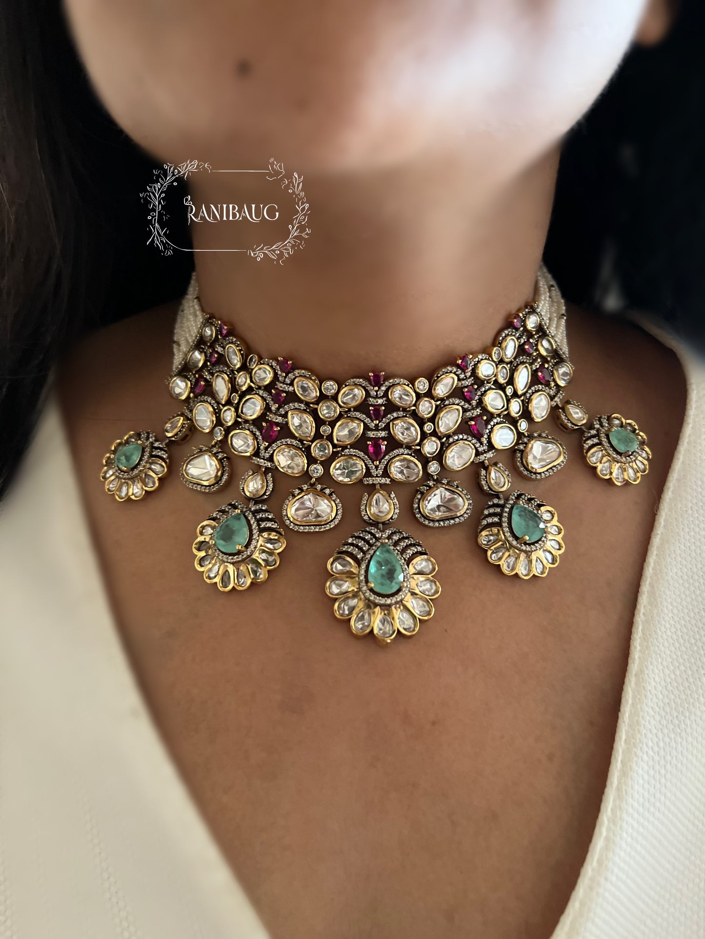 Nysa Vintage Floral Motif Mint And Ruby Accent Polki Studded Necklace Set In Matt Gold Finish By Ranibaug
