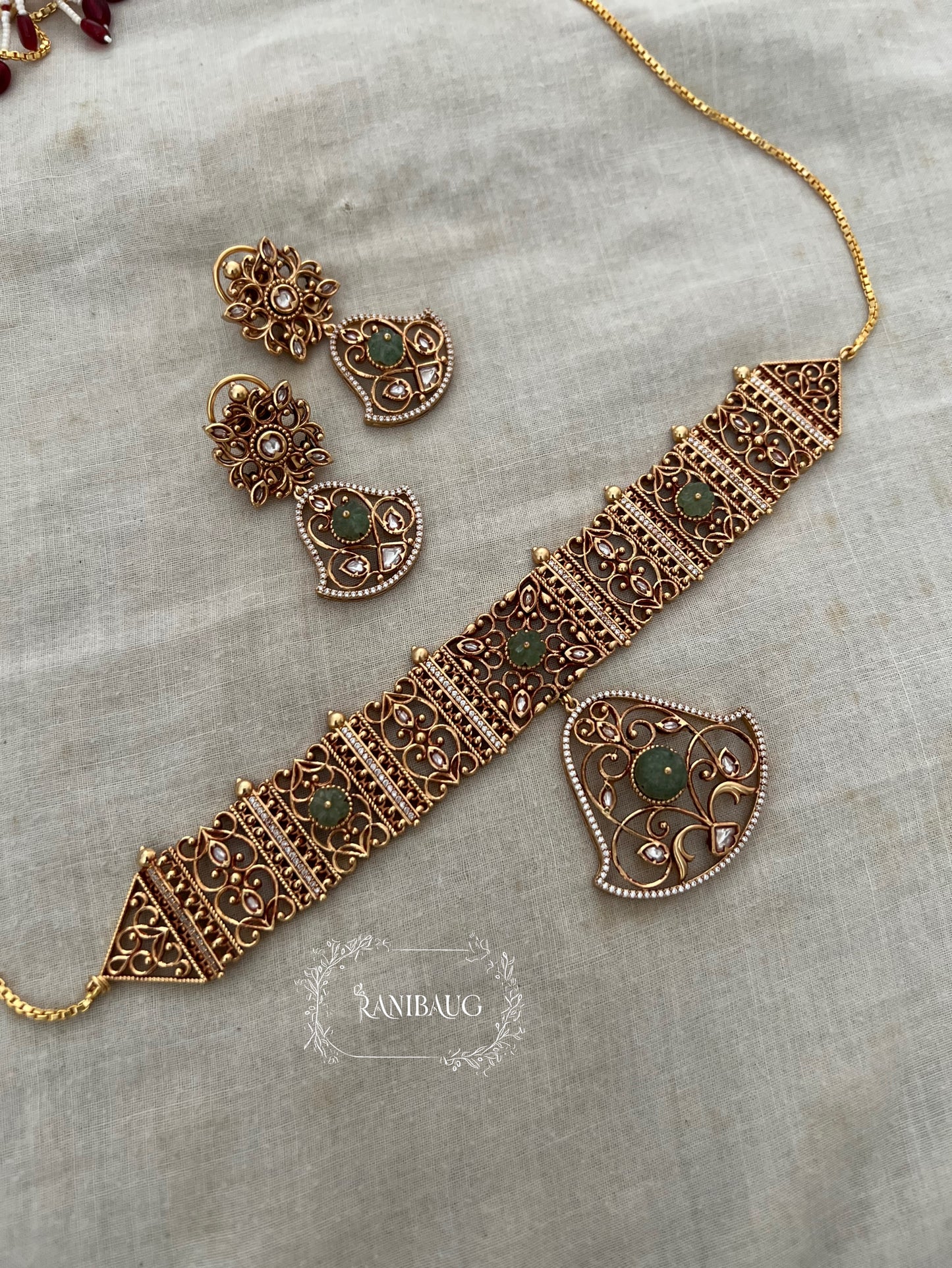 Padmavati Gold Plated Pendant Style Heritage Choker Set By Ranibaug | Trendy Temple Jewelry For Saree