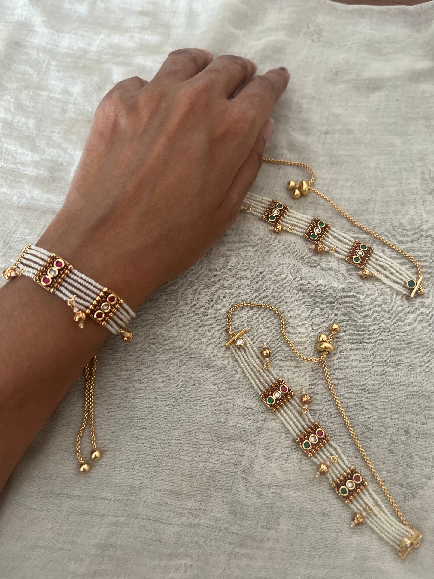 Padmini Pearl Strand Gold Finish Beaded Dangle Bracelet By Ranibaug