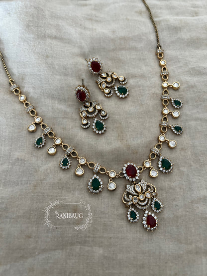 Pritisha Gold Finish Polki Ruby And Emerald Multi Color Drop Motif Designer Necklace Set By Ranibaug