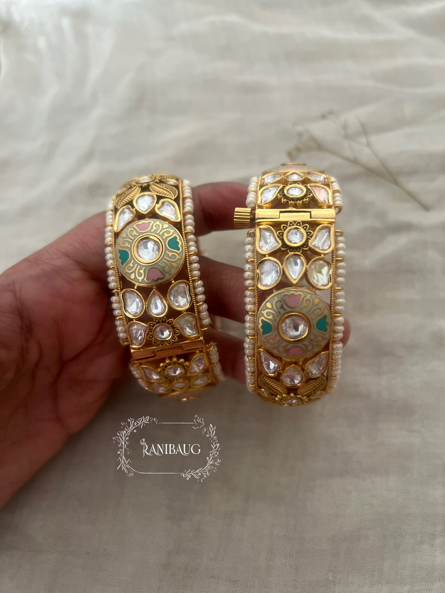 Priyanshi Kundan Pearl Bangles In Rich Gold Plating And Moon Motif By Ranibaug