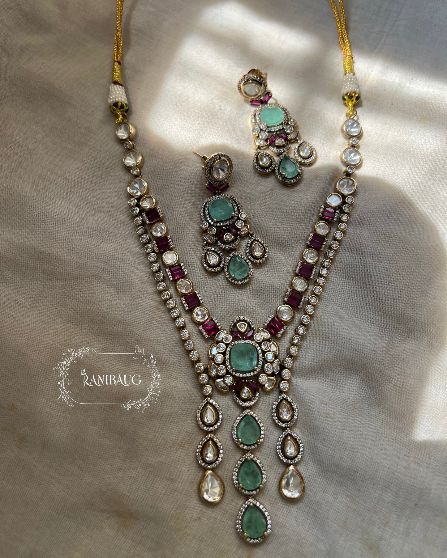 Purva Layered Aqua Drop Polki Studded Ruby Highlights Necklace With Earrings By Ranibaug