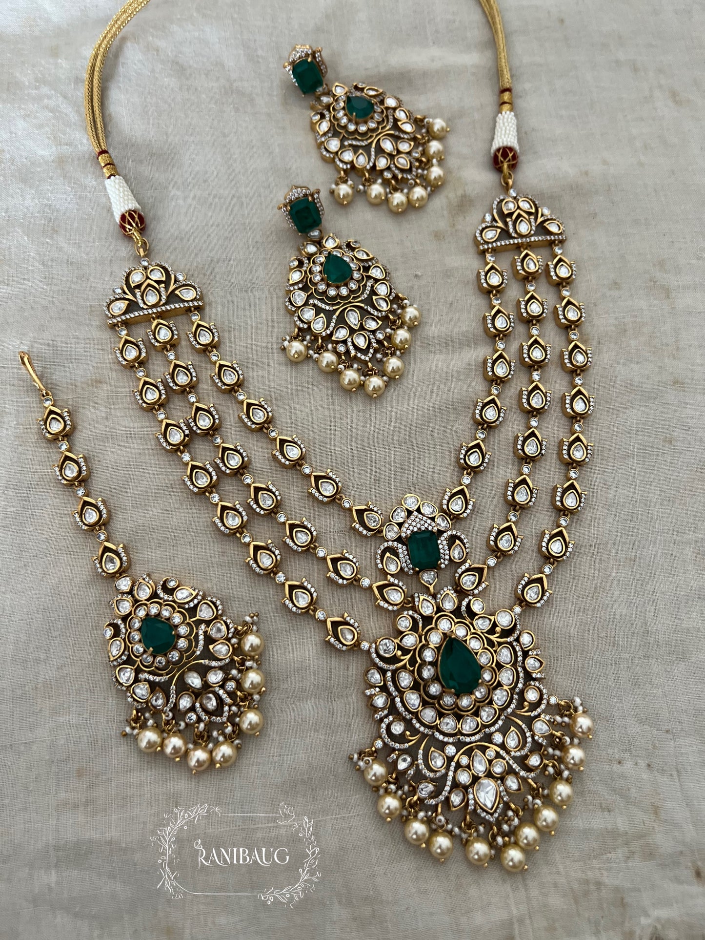Rajeshwari Cascade Layered Gold Finish Polki Pearl Adorned Haar With Maang Tikka Necklace Set By Ranibaug