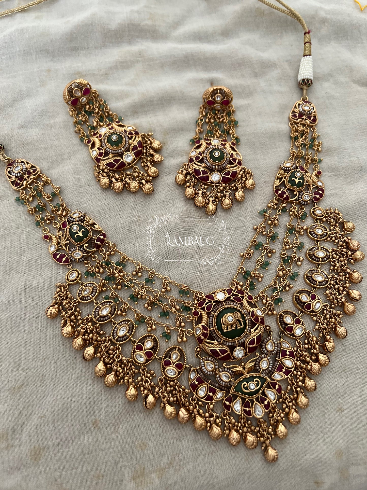 Rajnidhi Royal Heritage Elephant Motif Layered Gold Intricate Designer Necklace Set In Polki Emerald And Ruby Accents By Ranibaug