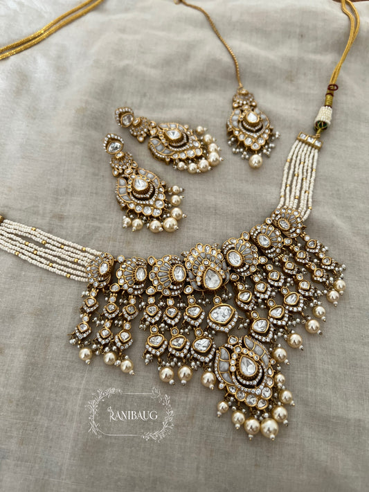 Rajnisha Polki Studded Zirconia And Pearl Adorned Enamel Gold Finish Necklace Jewelry Set With Maang Tikka By Ranibaug